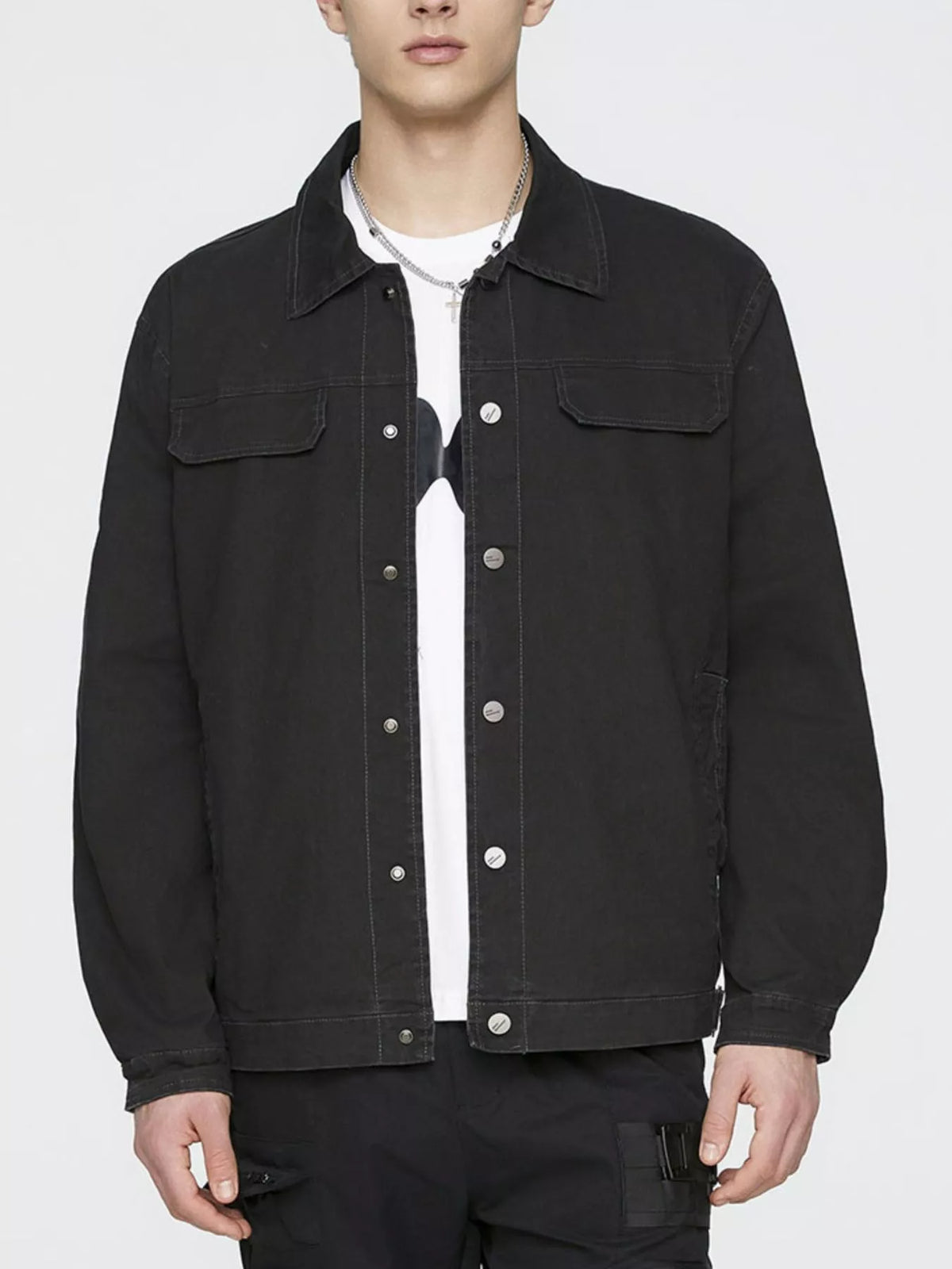 Men's black cotton button-up jacket with stand collar, snap buttons, and chest pockets
