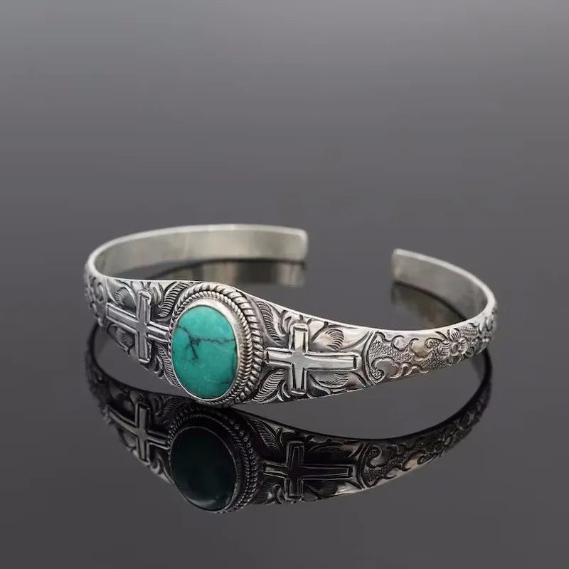 Engraved open cuff bracelet with large oval turquoise stone and dark oval inlay