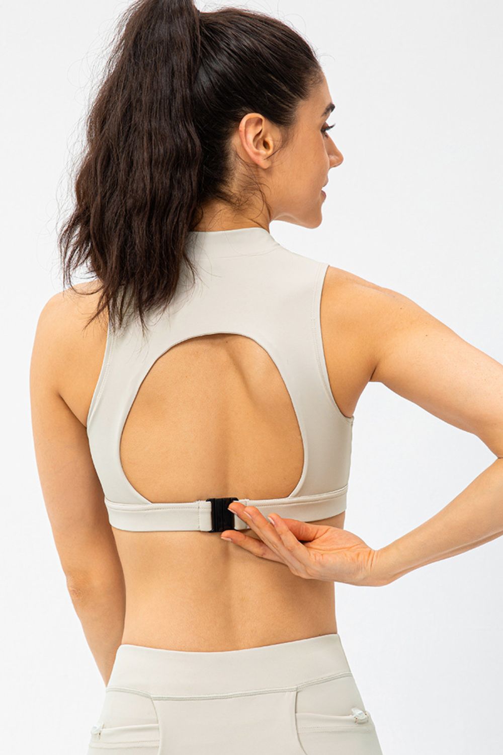 White active tank top with cutout back and front half-zip, sleeveless cropped fit