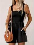 Black smocked wide-strap romper with sleeveless square neckline and tiered shorts