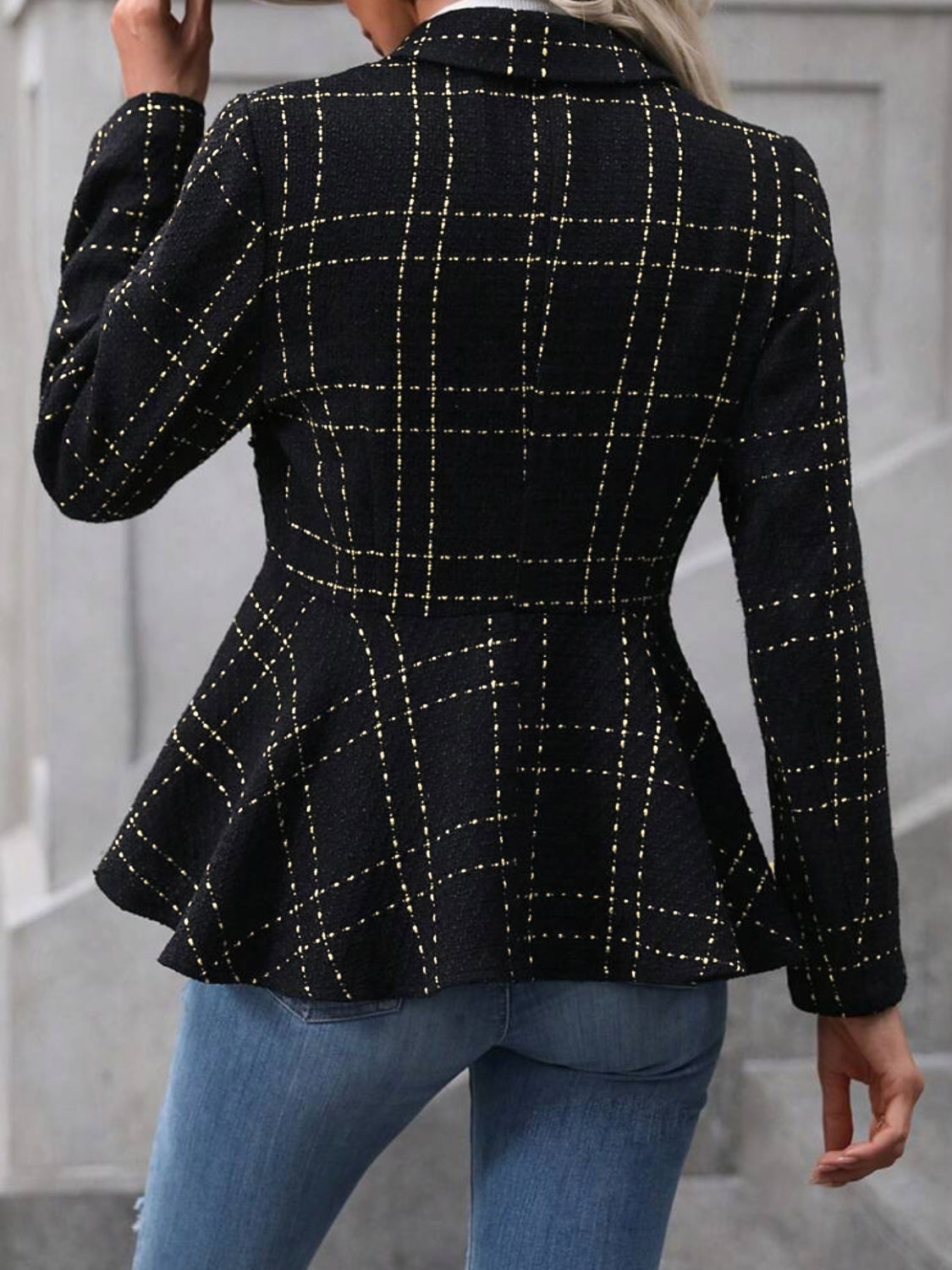 Black collared blazer with ruffle hem peplum and gold-button front, plaid stitch back view