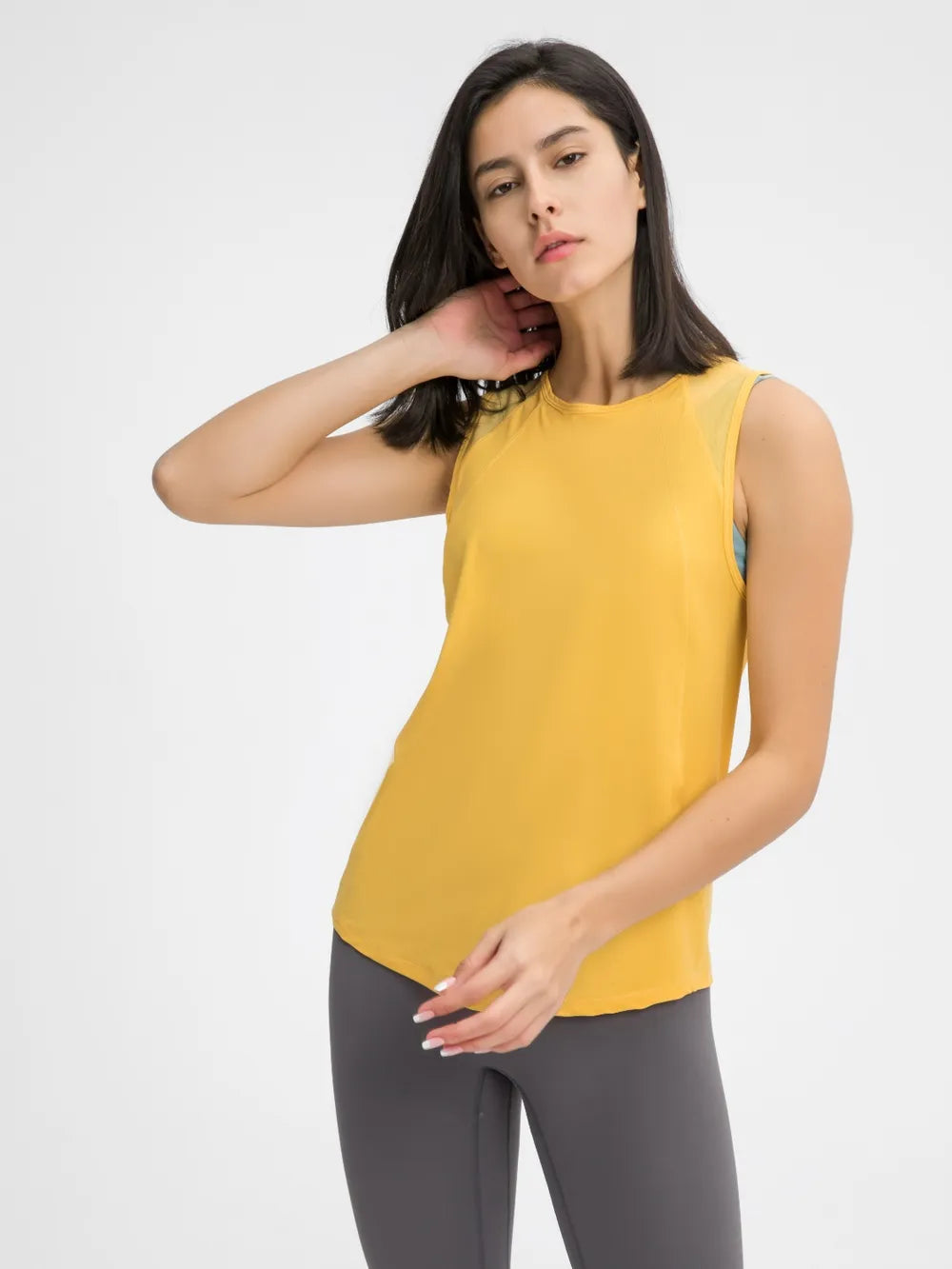 Yellow active tank top with sleeveless cut and round neckline
