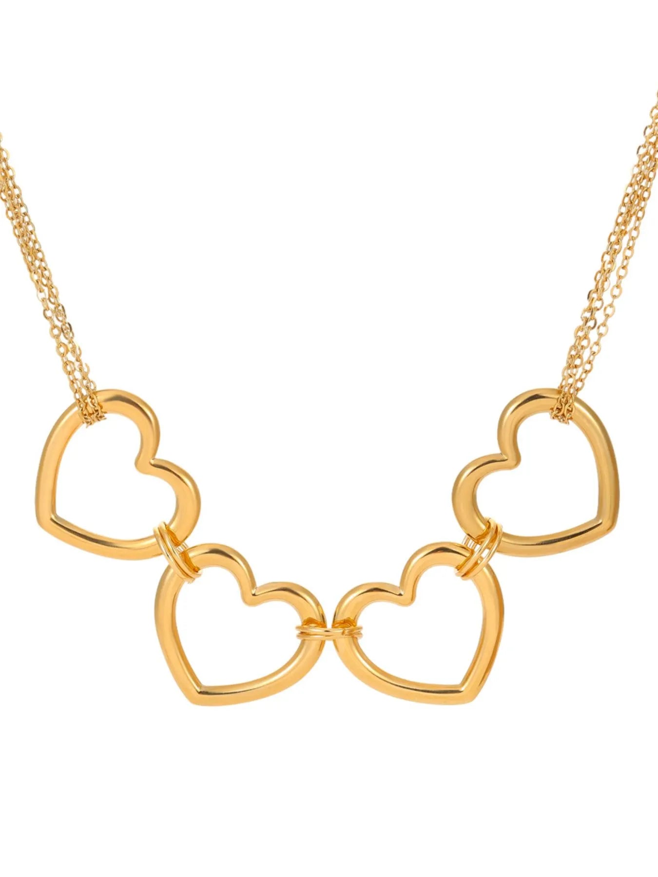Gold-plated heart charm necklace with four heart pendants on a chain
