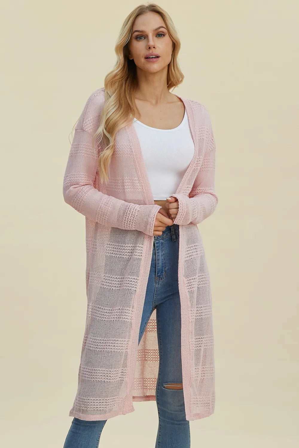 Blush pink open front longline cardigan with long sleeves and textured knit