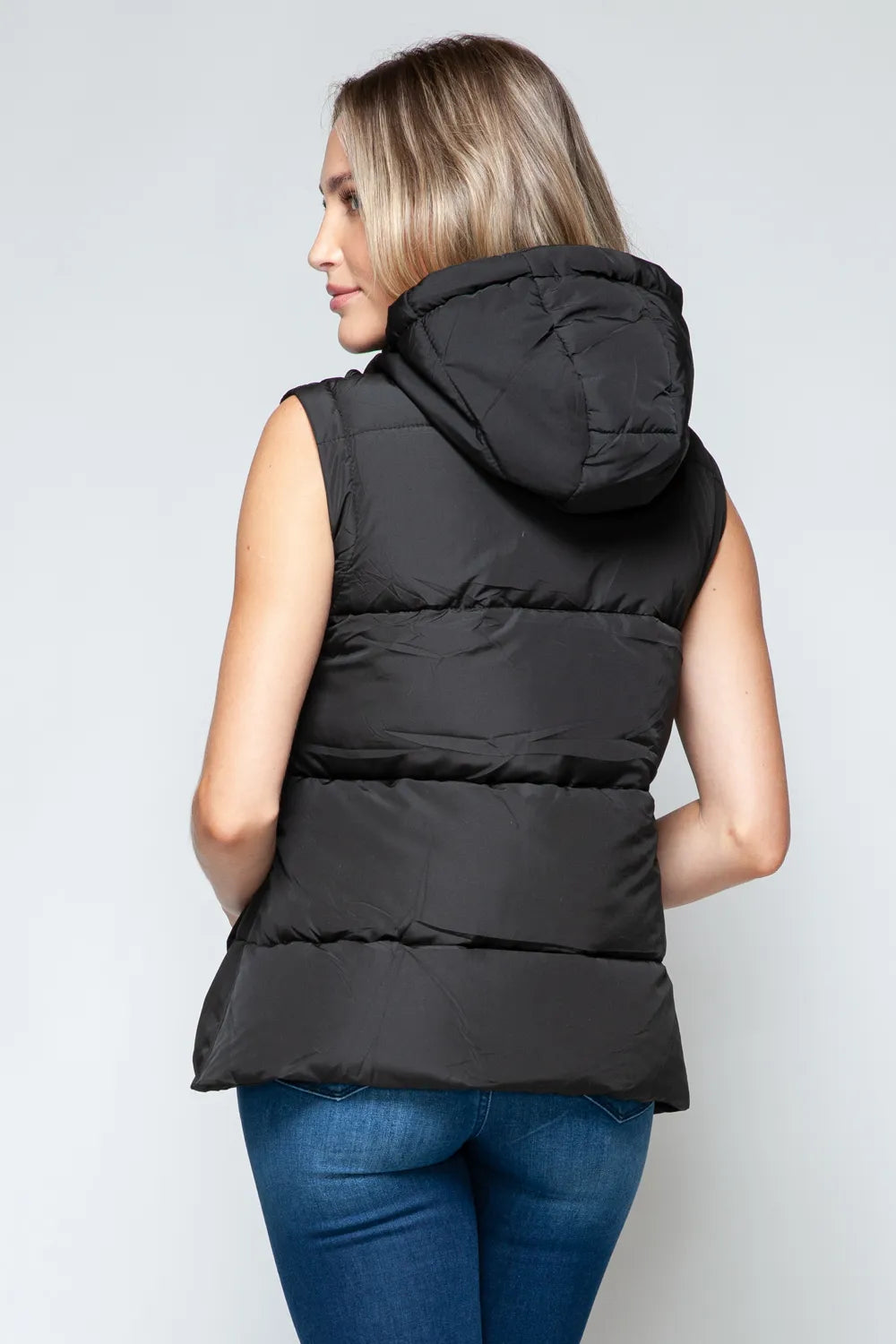 Black zip-front hooded puffer vest, three-quarter back view