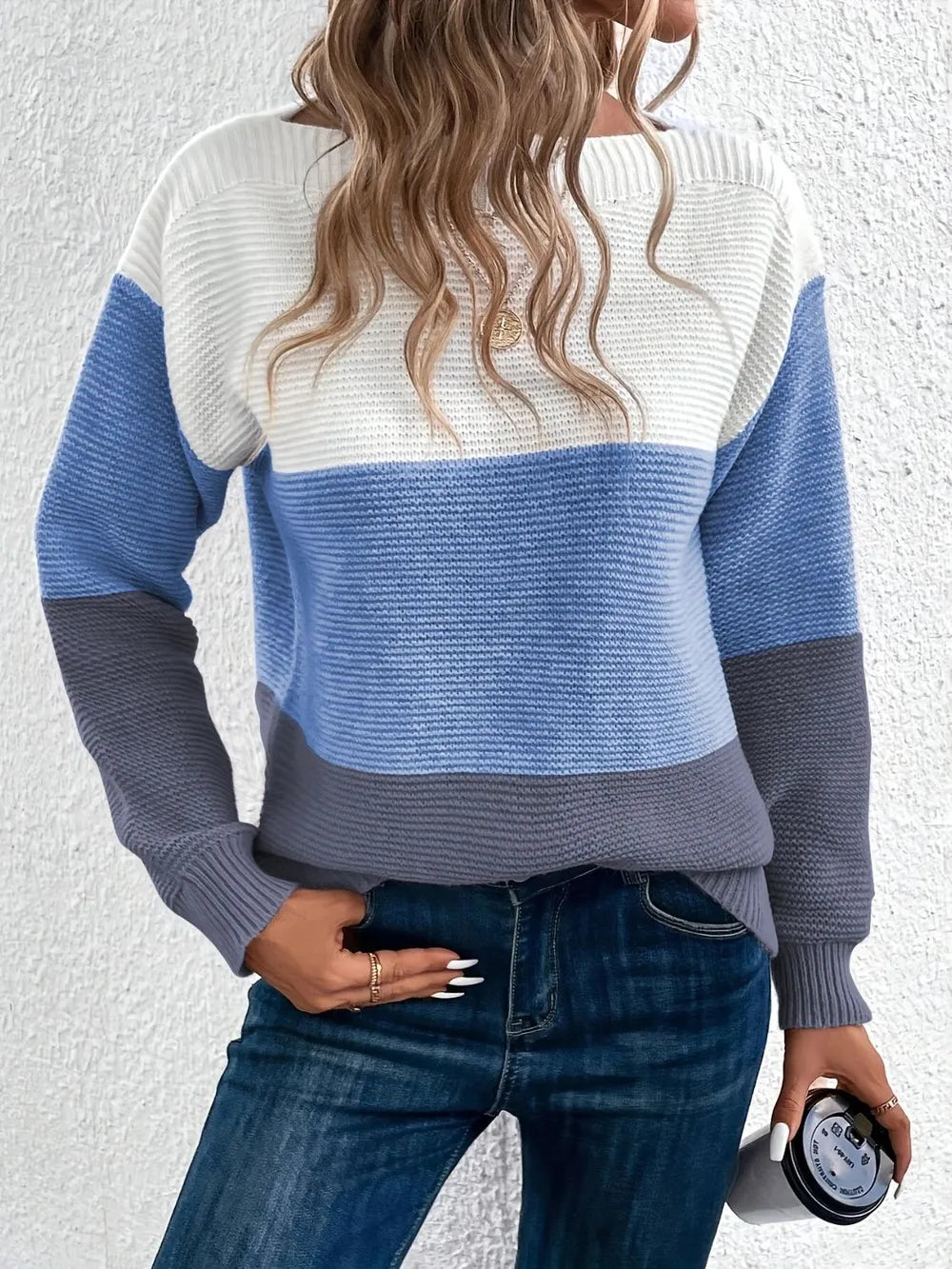 Boat-neck color block sweater with white upper, light blue middle, and dark gray hem