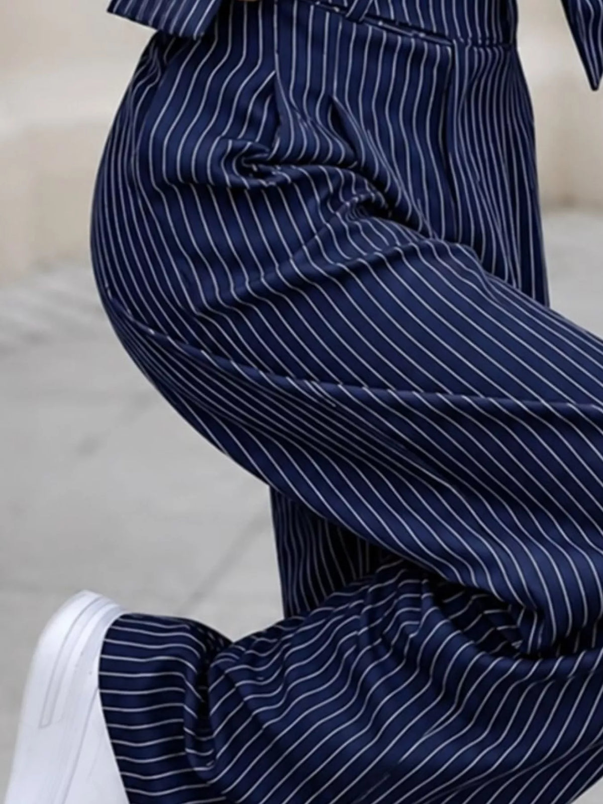 Navy pinstripe wide-leg pants fabric detail