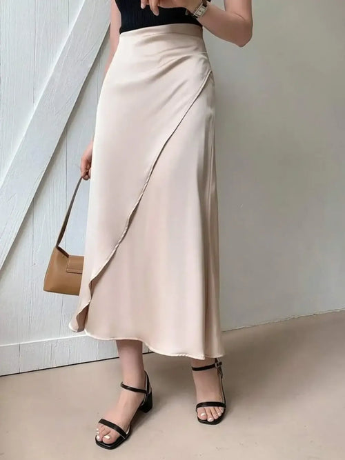 Asymmetric wrap midi skirt in beige with draped front and fluted hem