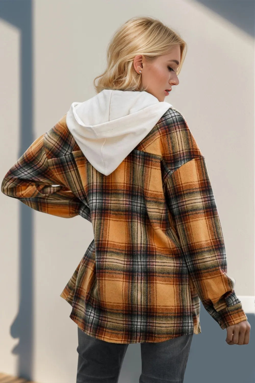 Orange plaid hooded shacket with drawstring hood, long sleeves, button front detail