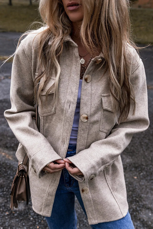 Dust Storm button-up collared jacket with front buttons and flap pockets, long sleeves.