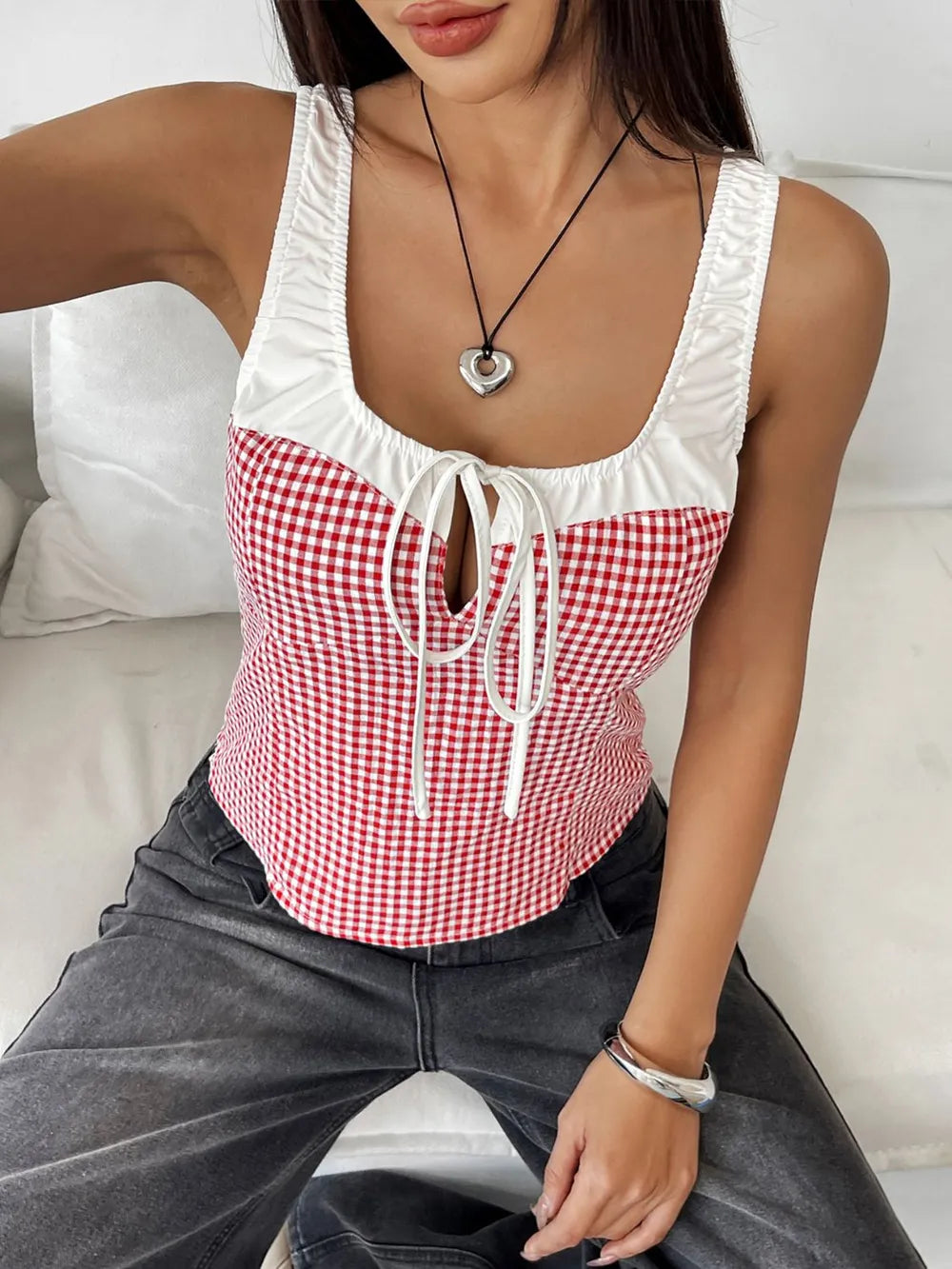 Deep red gingham square-neck tank top with white ruffle trim and front drawstring bow