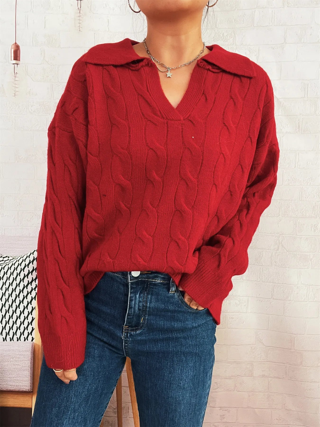 Red cable-knit Johnny collar sweater with textured cable knit and ribbed cuffs