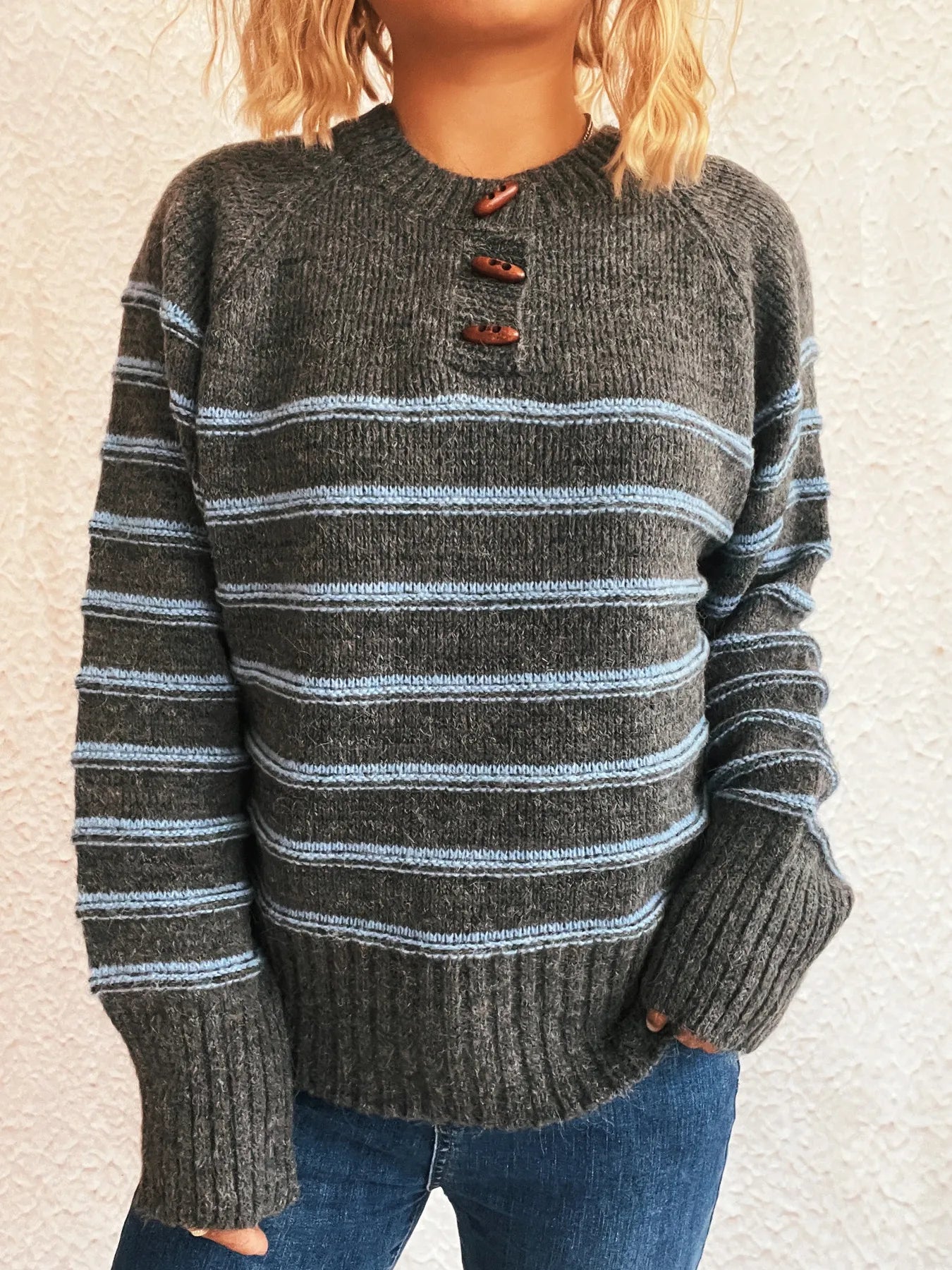 Dark gray striped long sleeve sweater with button placket and ribbed hem
