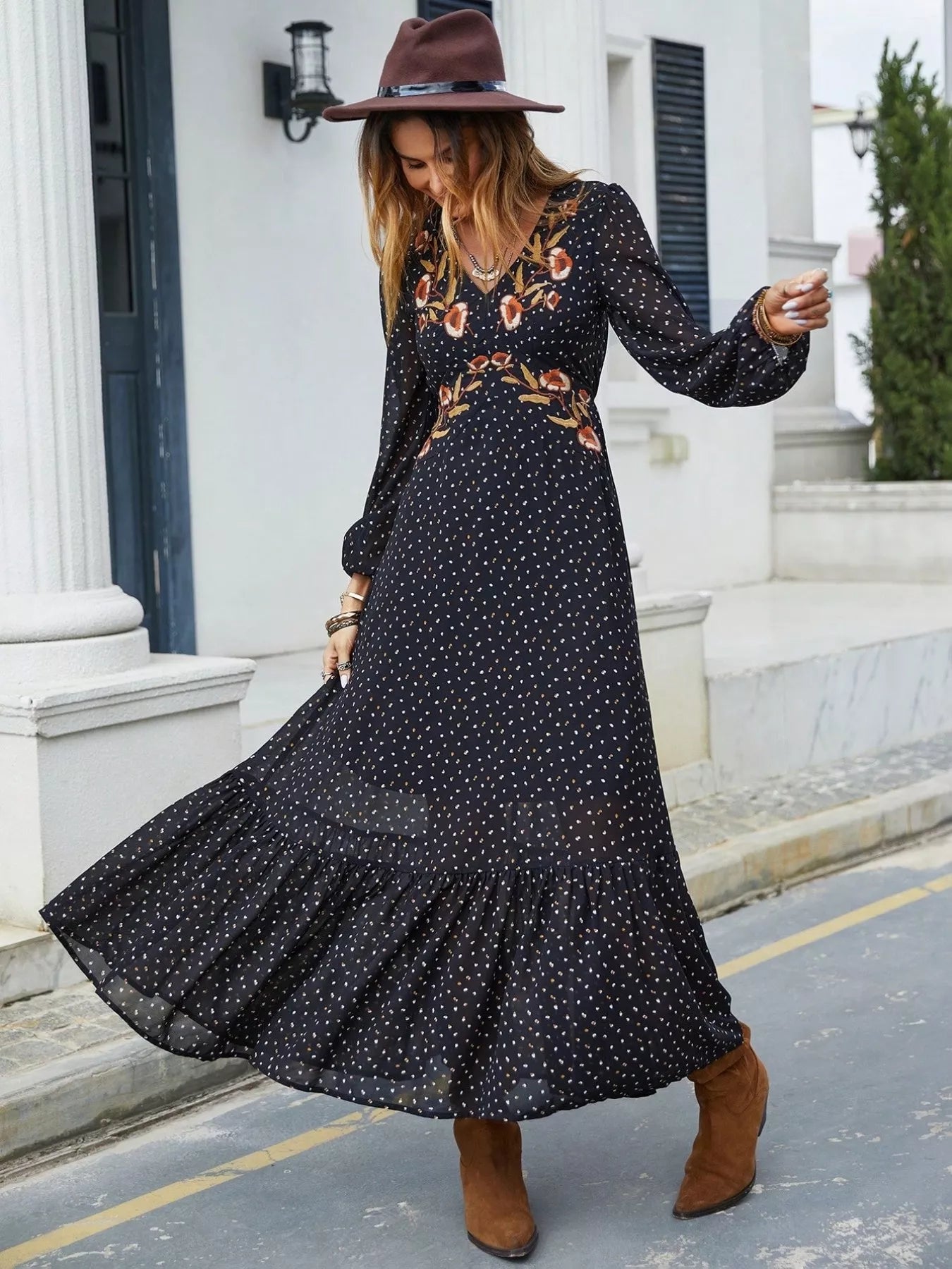 Black plus size maxi dress with V-neck, long sleeves, embroidered floral accents
