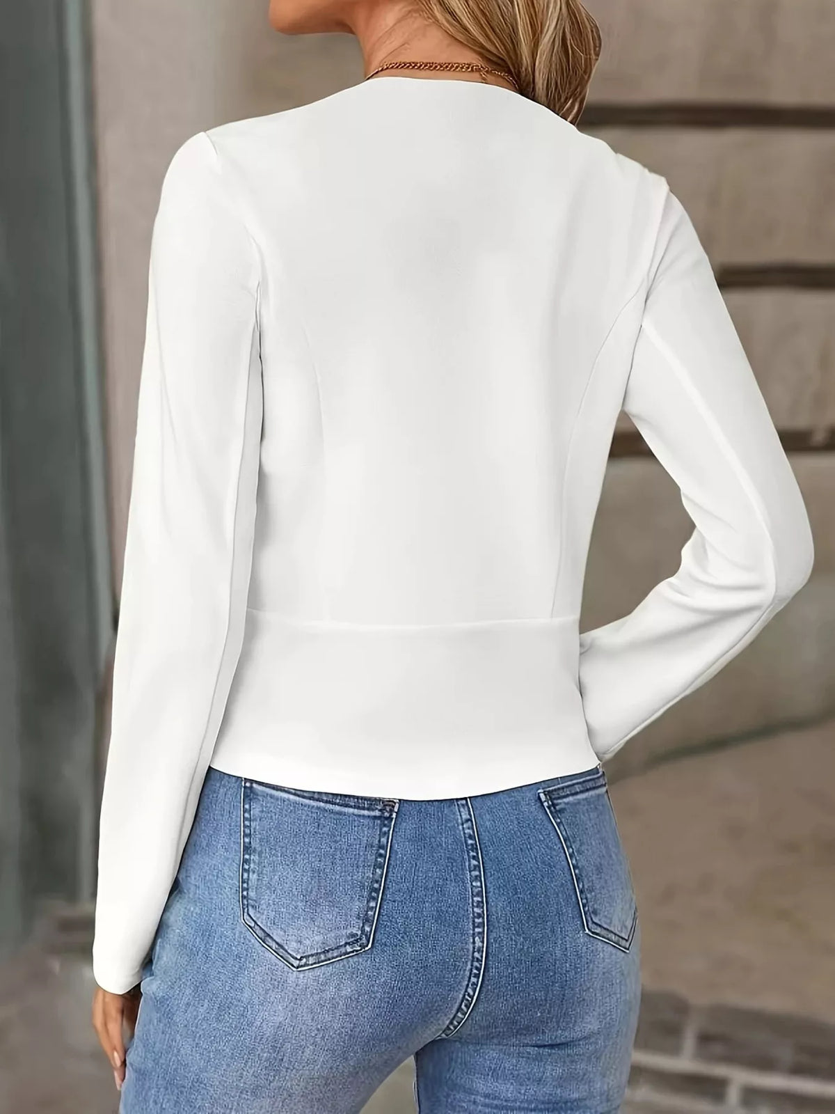 White cropped open-front blazer back view with long sleeves and seam detailing