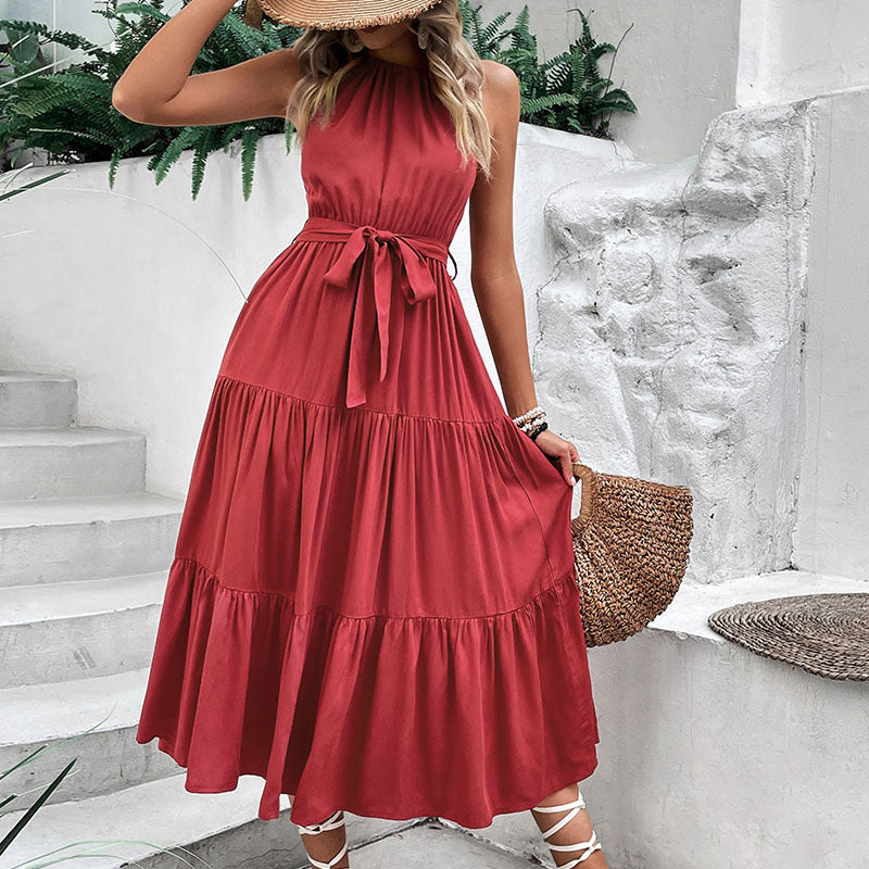 Burgundy halter tiered midi dress with knotted tie belt at waist, sleeveless
