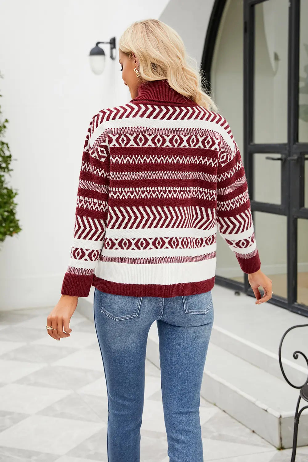 Geometric turtleneck sweater in deep red and white with long sleeves, back view
