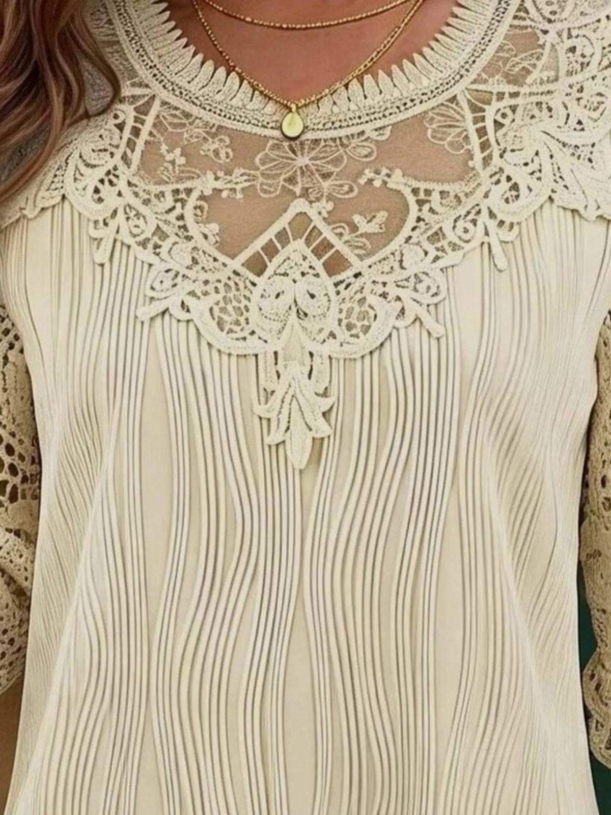 Cream lace yoke long-sleeve blouse with floral crochet overlay and pleated fabric pattern