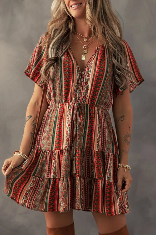 Floral bohemian tiered dress with ruffled V-neck and short button sleeves