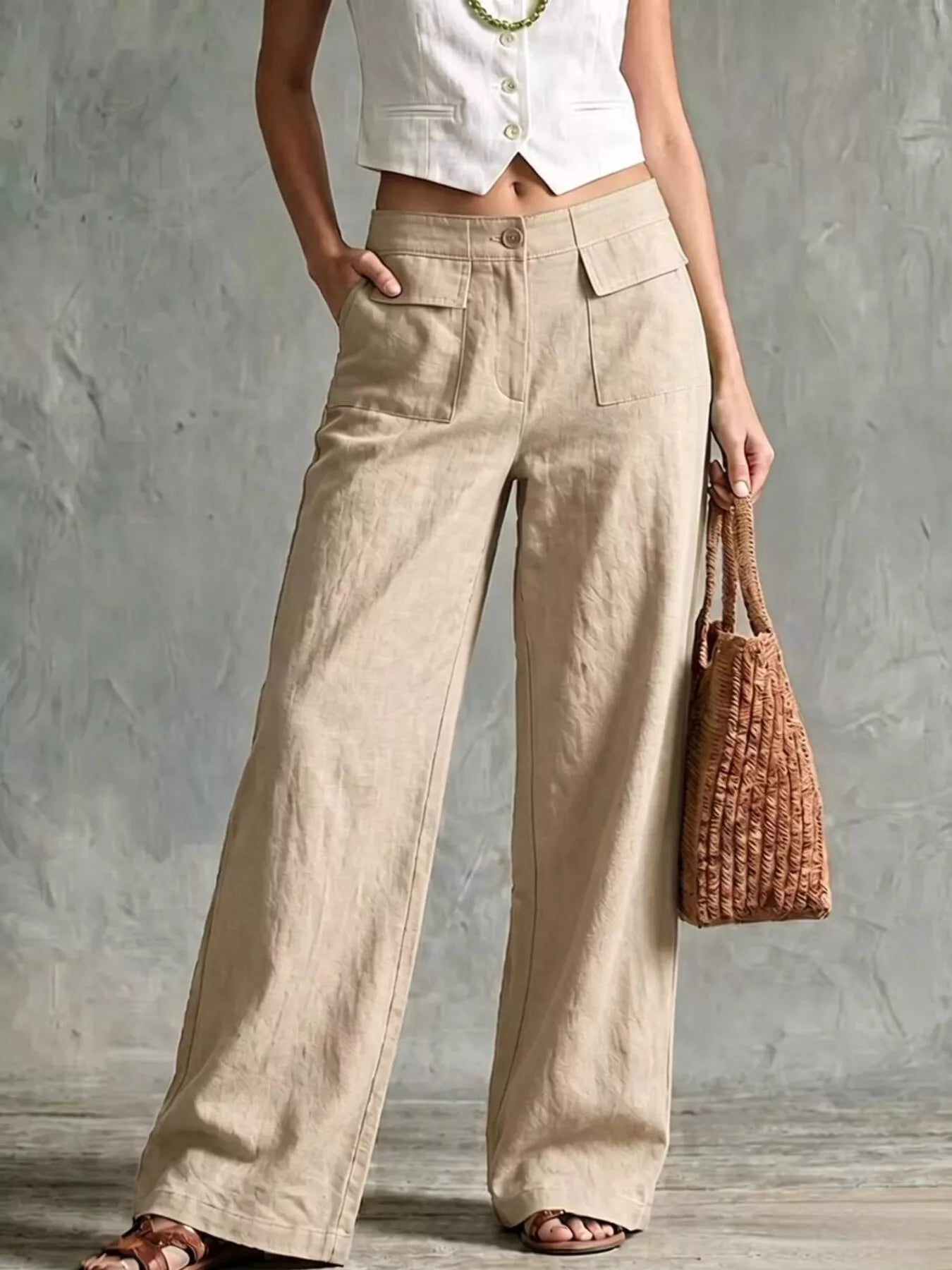 Beige wide-leg pants with front pockets and elastic waistband