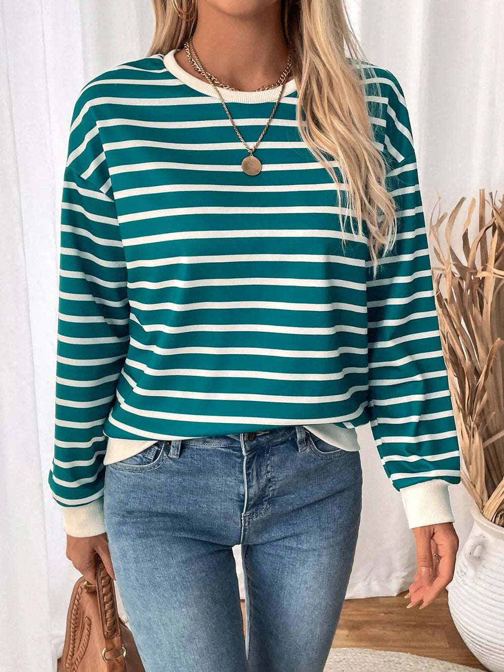 Turquoise and white striped long-sleeve sweatshirt with round neck and contrast cuffs