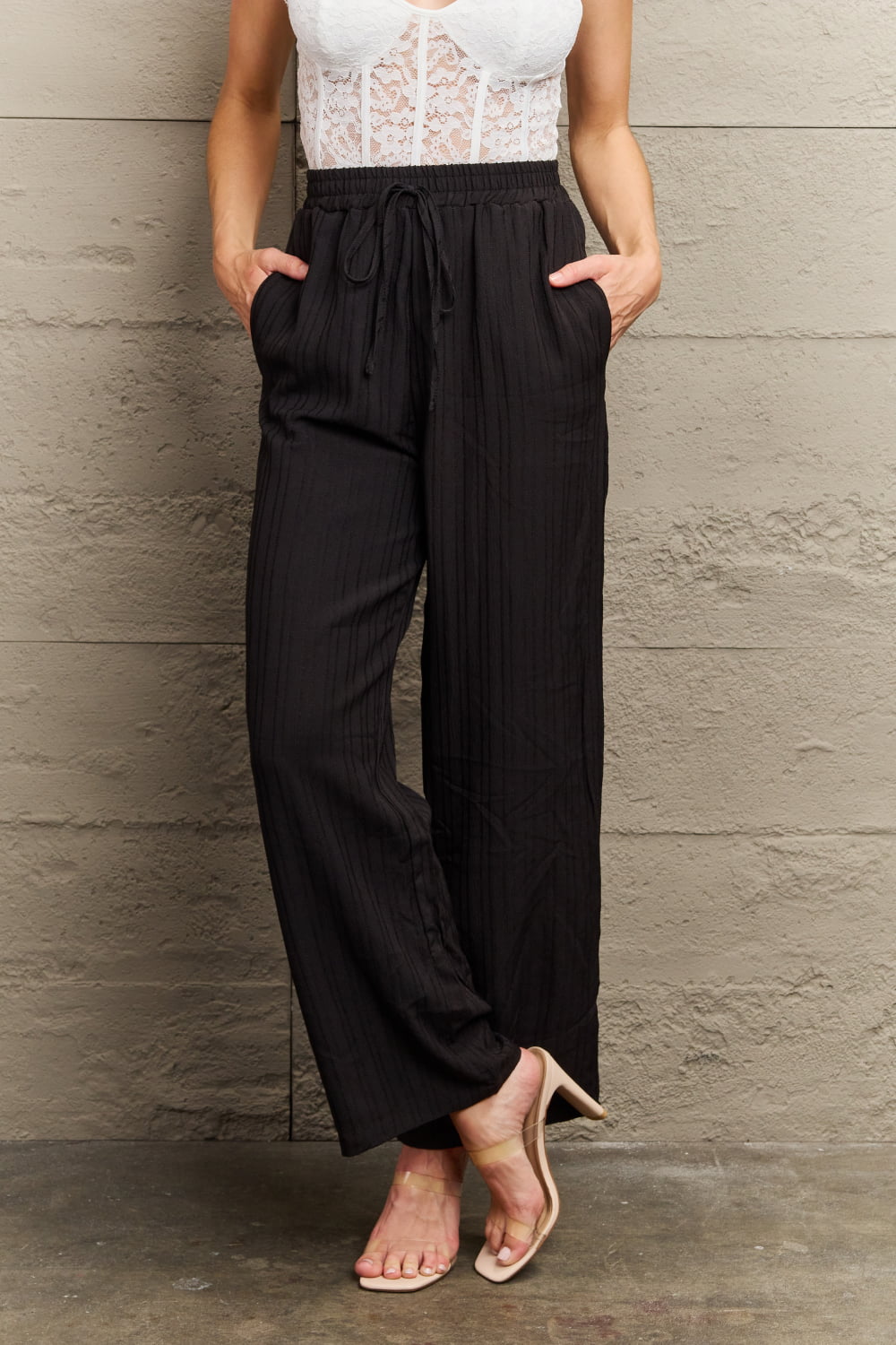 Black tie-waist long pants with elastic waist and drawstring, relaxed wide legs