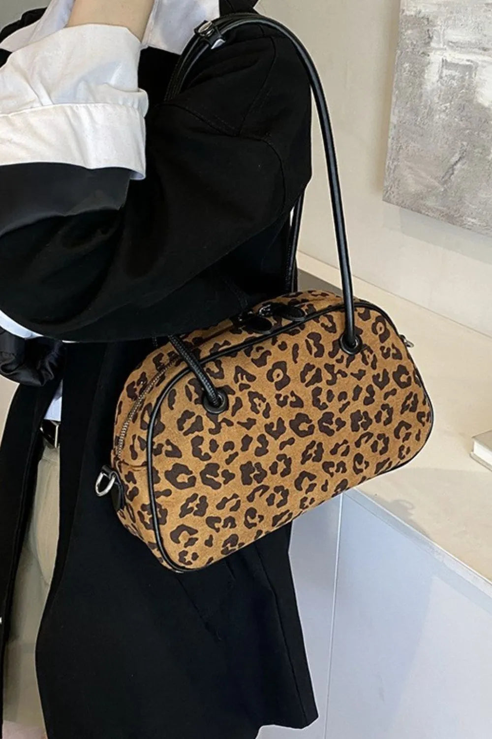Caramel leopard suede medium shoulder bag with black handles and zip top opening