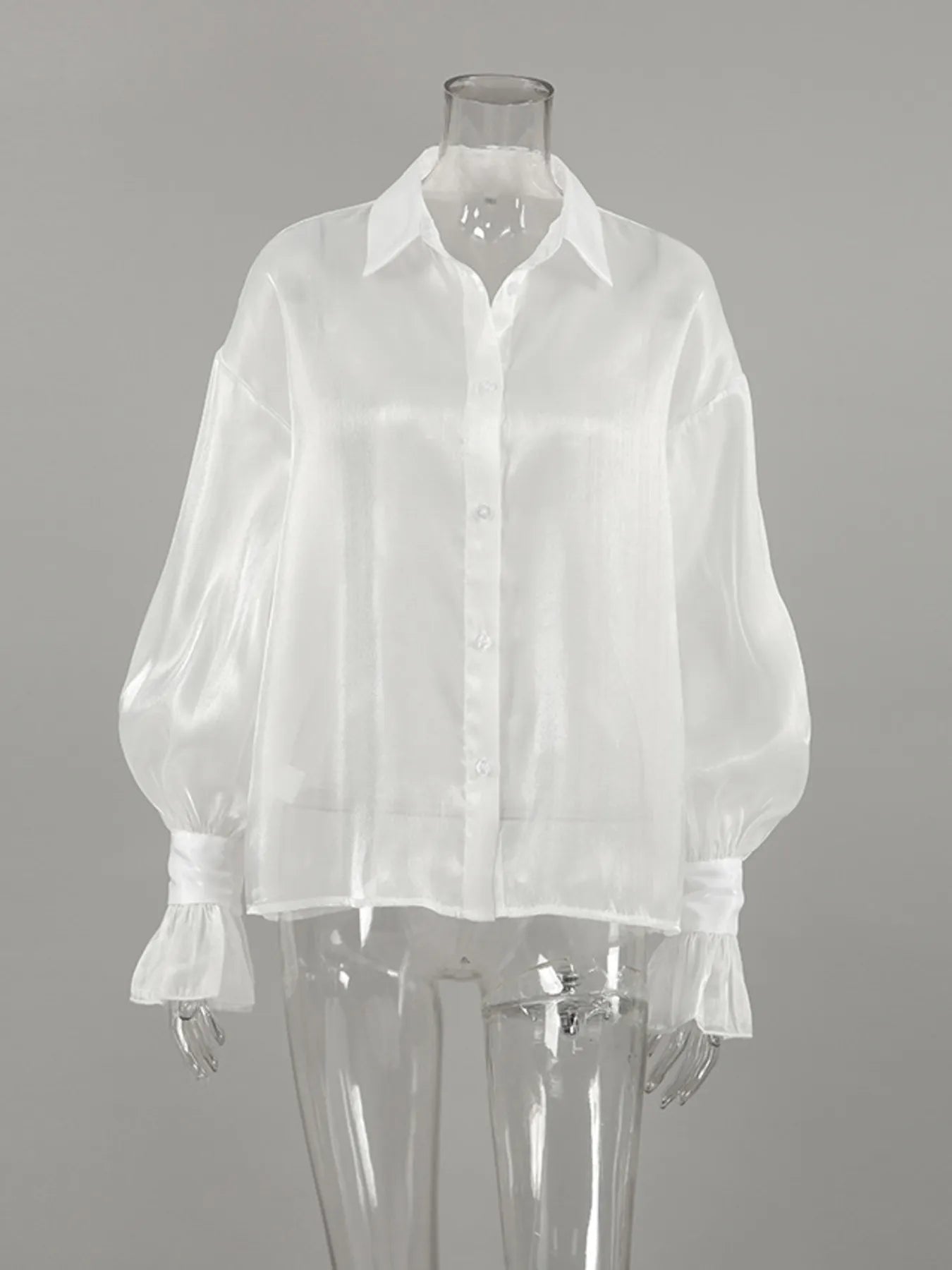 White button-up flounce sleeve shirt on mannequin with ruffled cuff sleeves