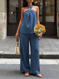Navy blue halter neck top and wide-leg pants set with tied neckline