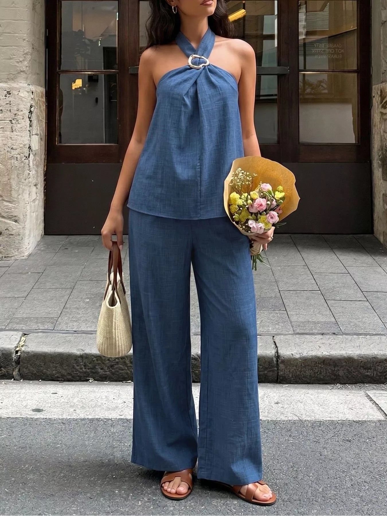 Navy blue halter neck top and wide-leg pants set with tied neckline