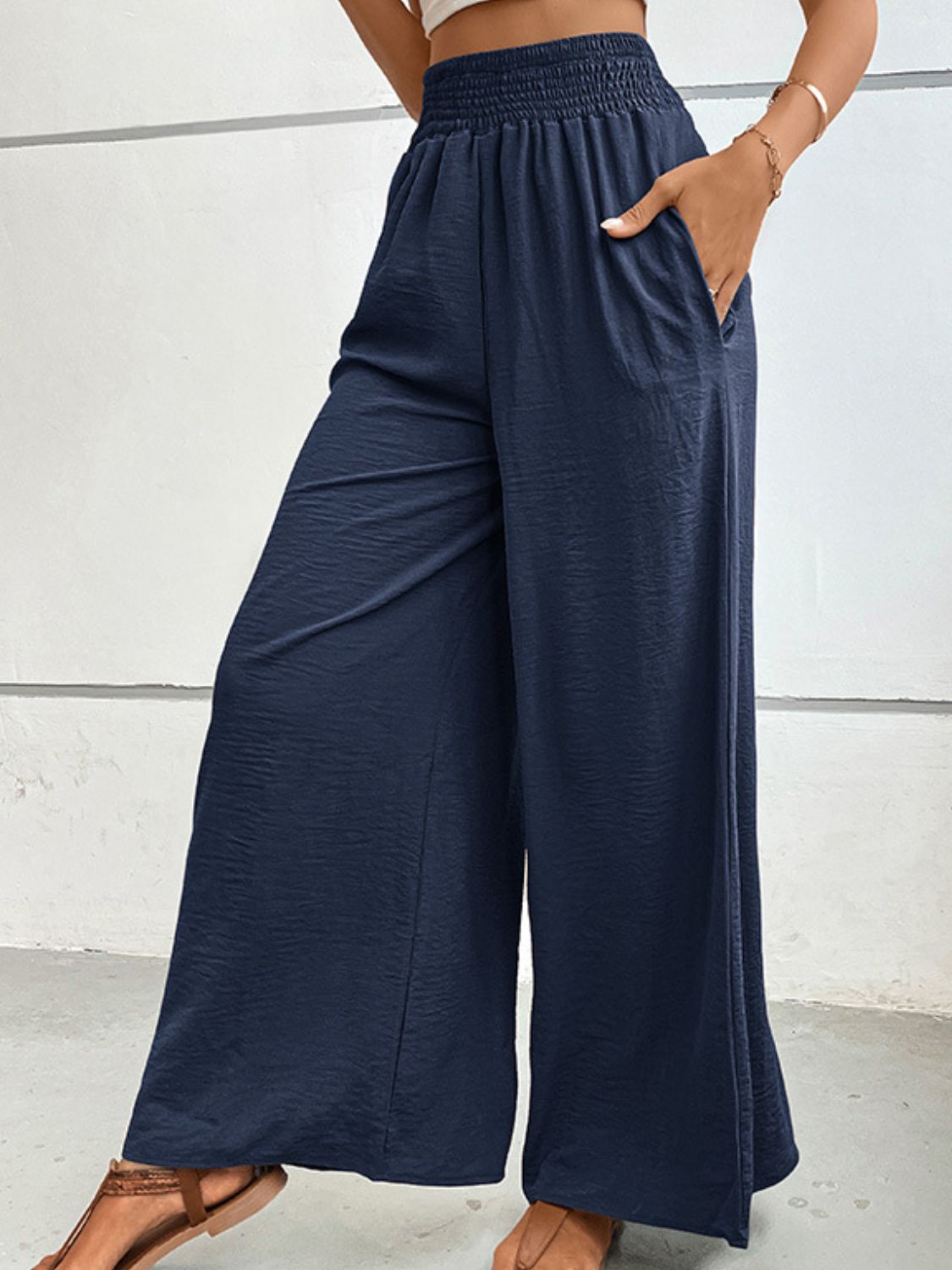 Navy wide-leg long pants with gathered waist and flowing drape