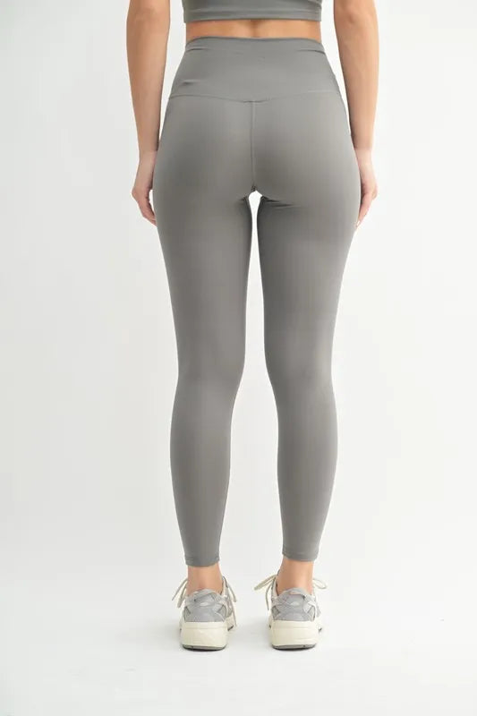 High-waisted pewter gray leggings, back view, fitted stretch fabric