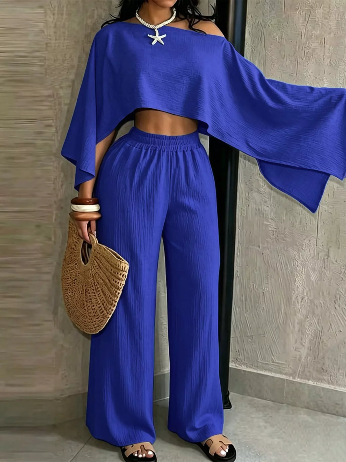 Women’s blue boat-neck crop top with wide-leg pants, loose batwing sleeves
