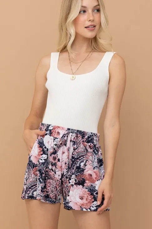 Floral print shorts with adjustable drawstring waist in mauve, navy, and pink