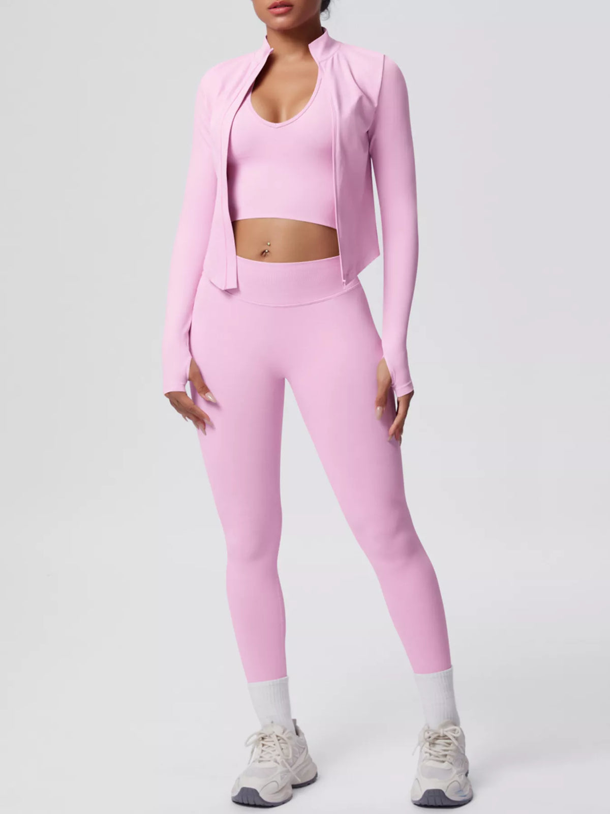 Mauve seamless workout set: cropped zip jacket, sports bra, and leggings