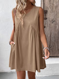 Ivy Lane Ruched V-Neck Sleeveless Mini Dress in tan beige with front ruched detail and flowy silhouette