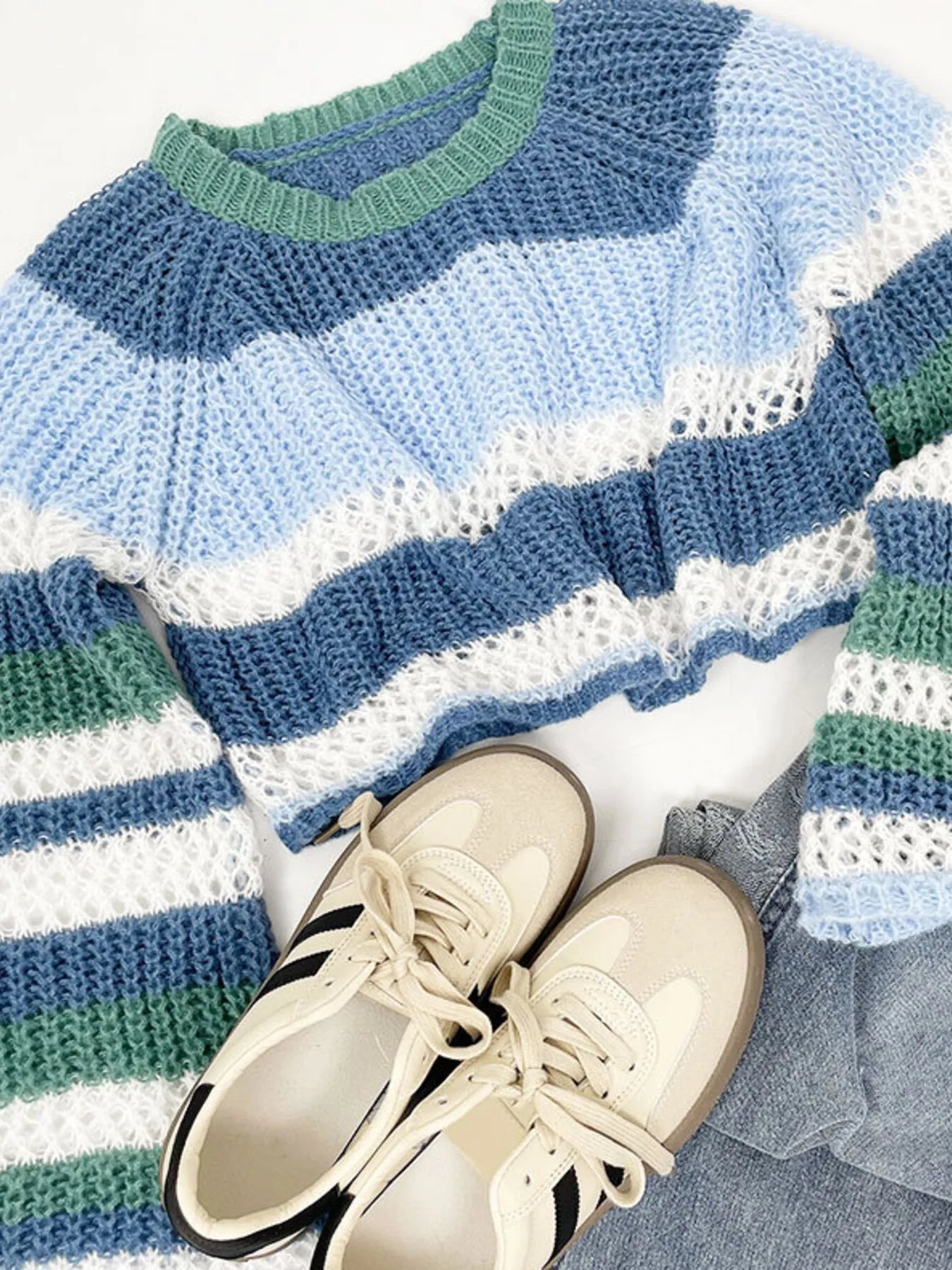 Openwork knit striped crop sweater close-up with ribbed crew collar