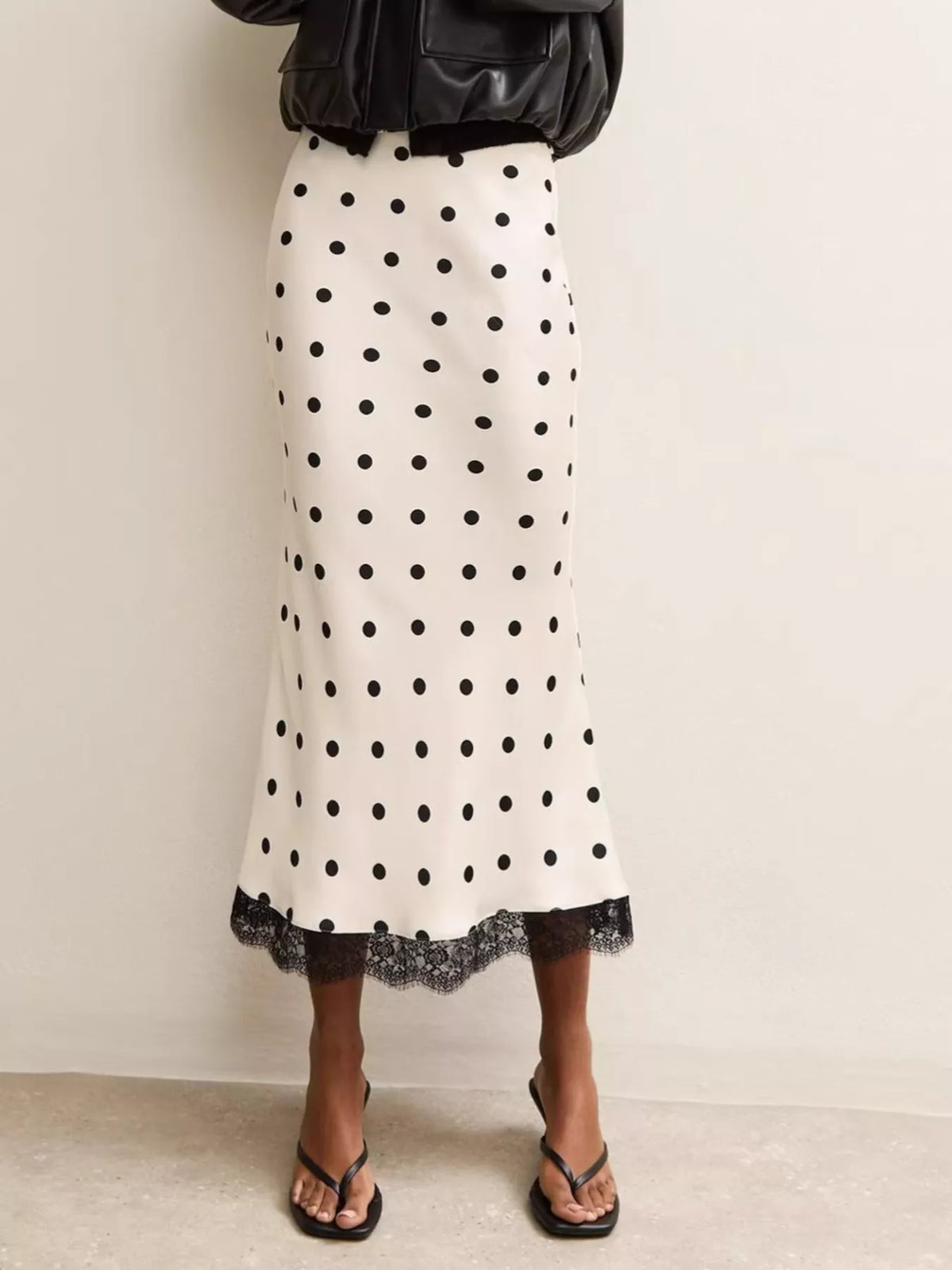 White midi skirt with black polka dots and scalloped lace hem trim