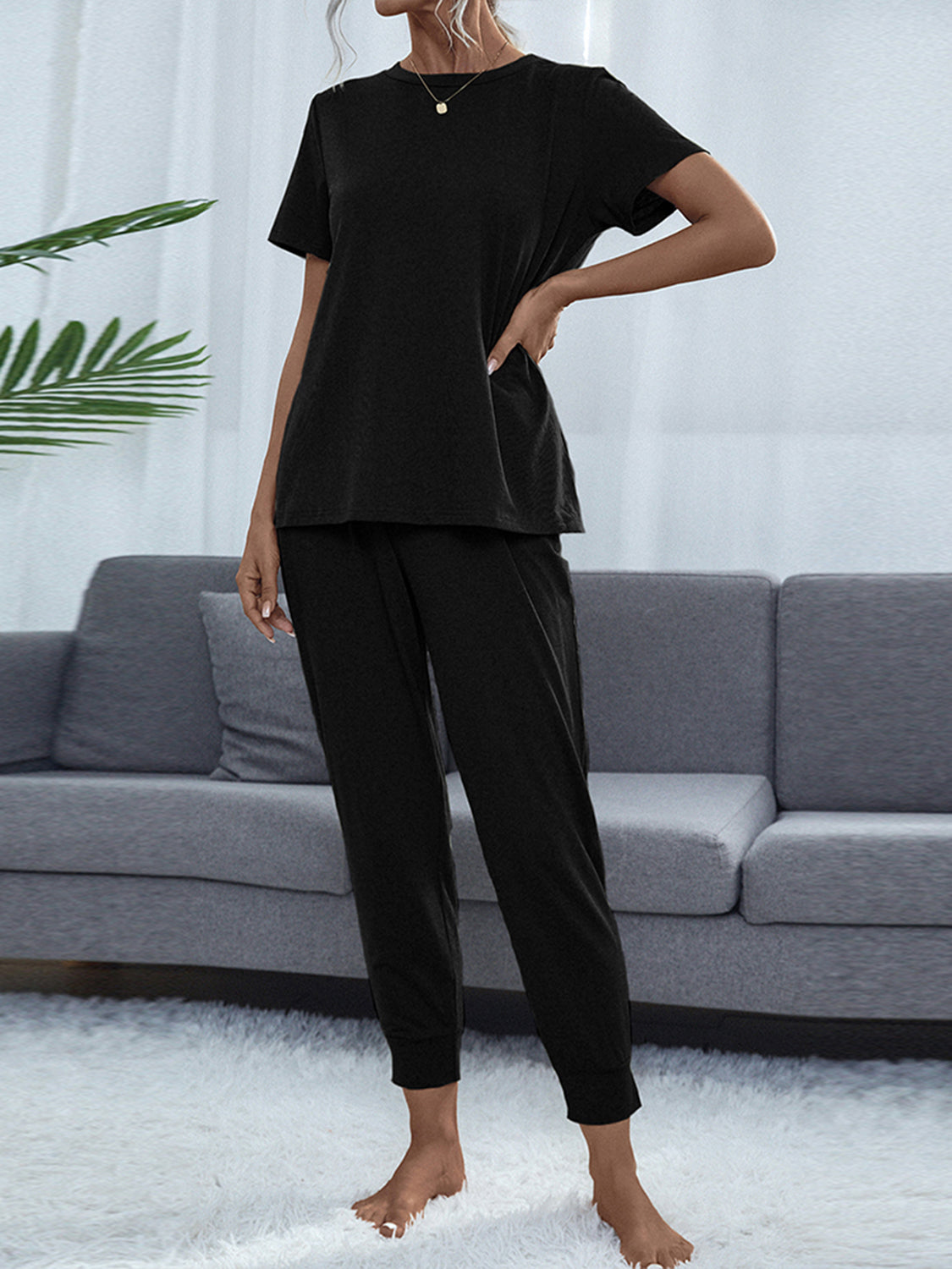 Shiny round-neck short-sleeve top and jogger pants set, black, side view