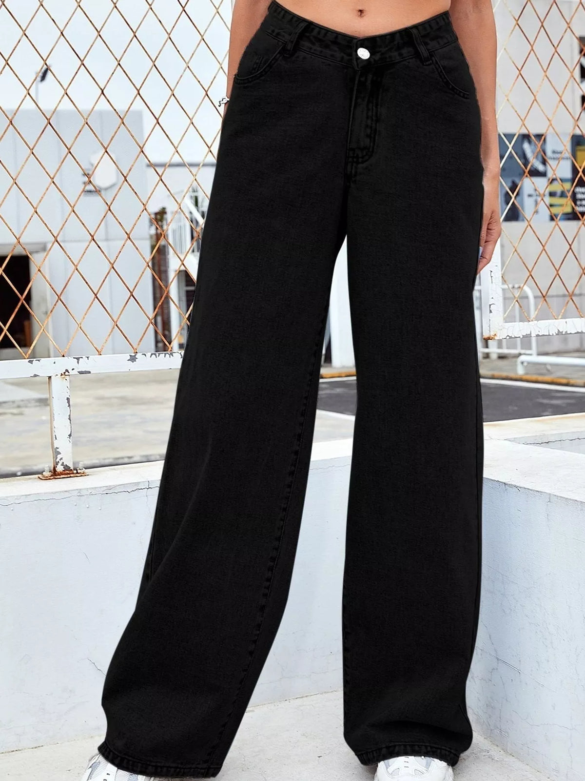 High-waisted wide-leg denim jeans, solid black, button closure, front pockets