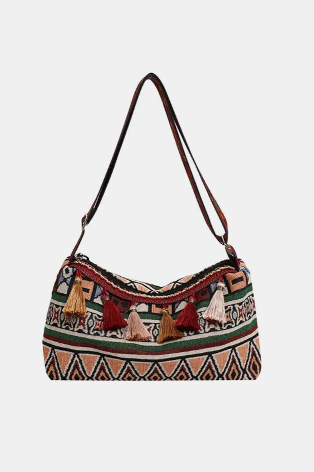 Tassel shoulder bag with adjustable strap, dark red patterned fabric and woven trim.