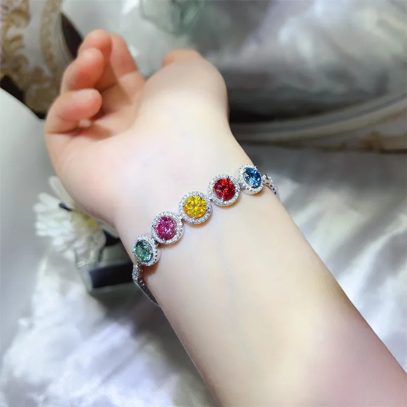 925 sterling silver bracelet with multicolor round gemstone charms on wrist
