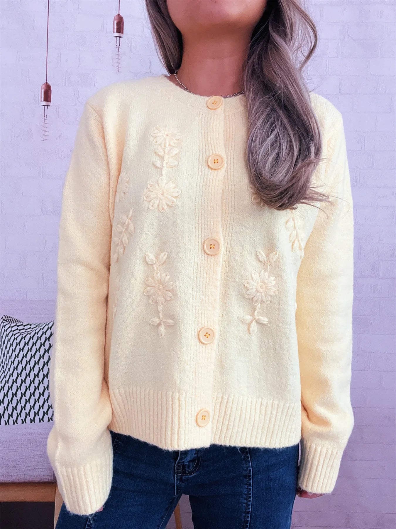 Cream cardigan with flower embroidery and round button placket, ribbed hem