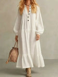 Ivory tiered button-front maxi dress with long puff sleeves and V-neck placket
