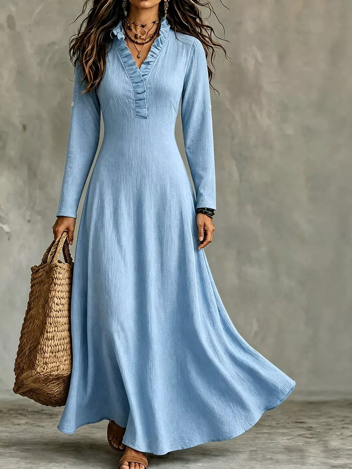 Light blue maxi dress with frill V-neck, long sleeves, and flowing gathered skirt
