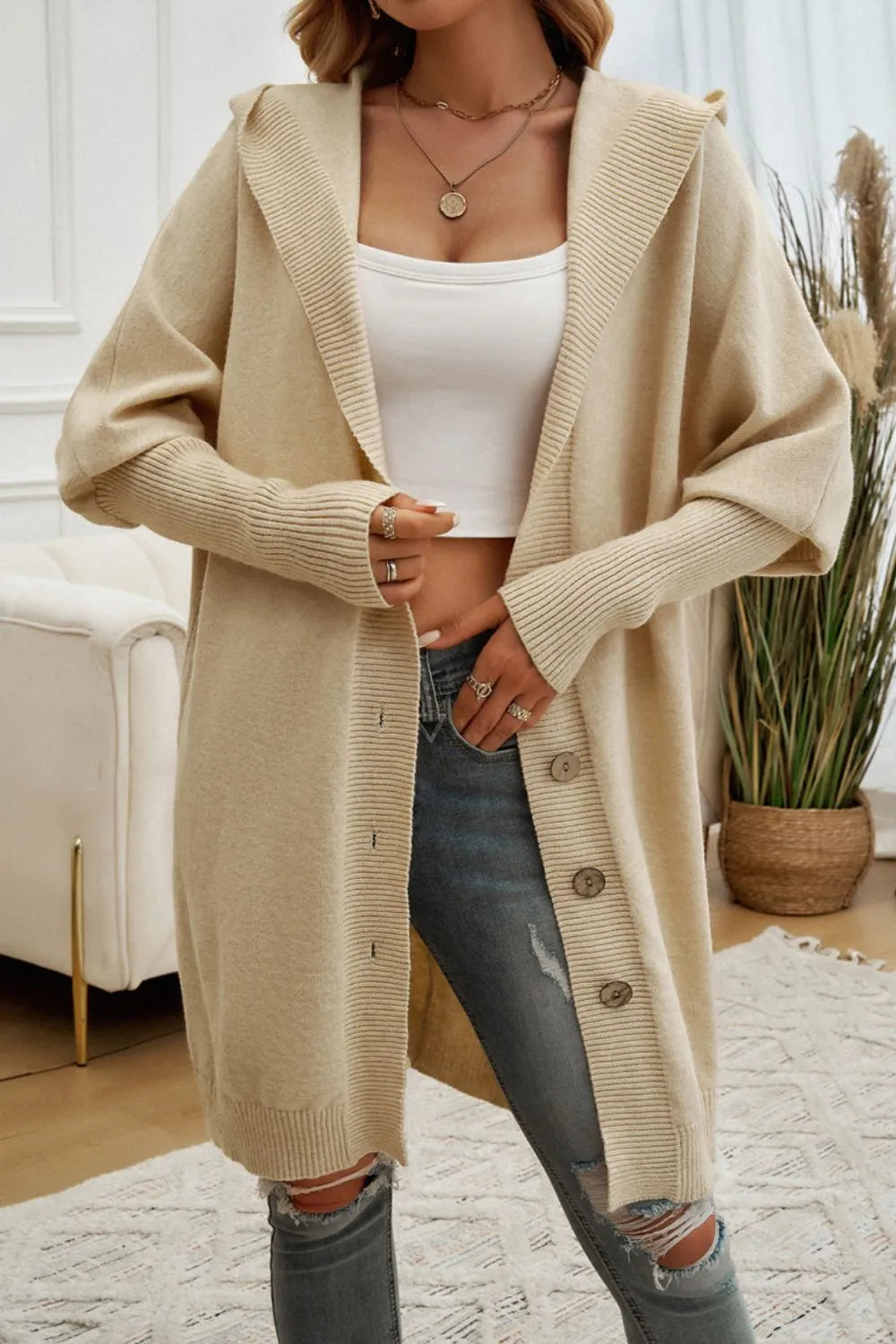 Tan hooded long cardigan with button placket, open front, and ribbed knit sleeves.