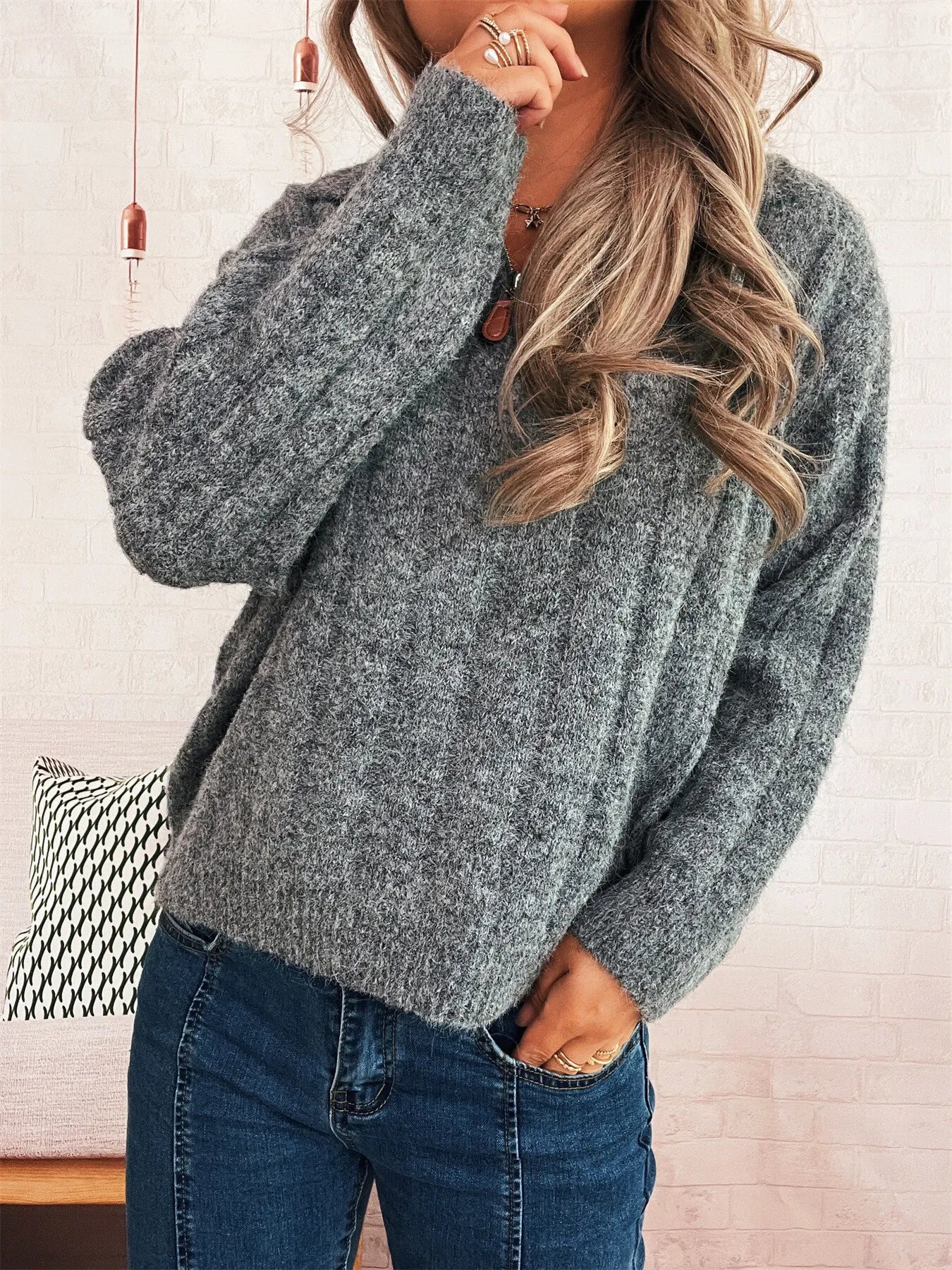 Ribbed hem quarter-zip sweater, heather gray knit with half-zip placket and ribbed cuffs.
