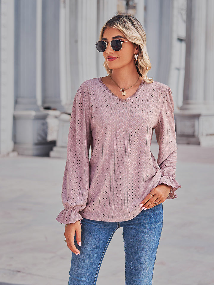 Blush pink eyelet V-neck blouse with flounce sleeves and textured eyelet pattern, front