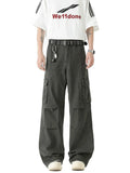 Dark green wide-leg cargo pants with flap pockets and studded belt