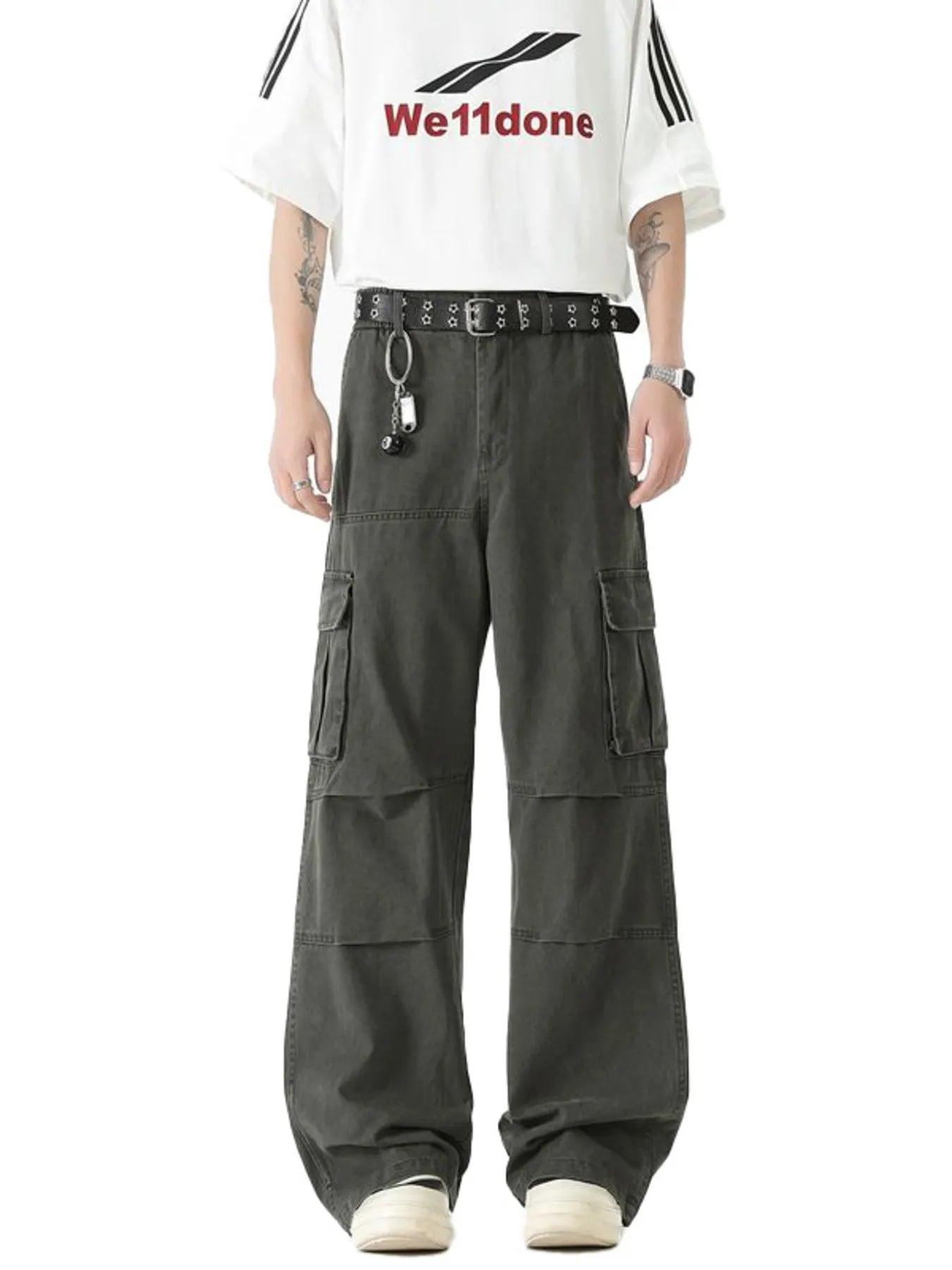 Dark green wide-leg cargo pants with flap pockets and studded belt